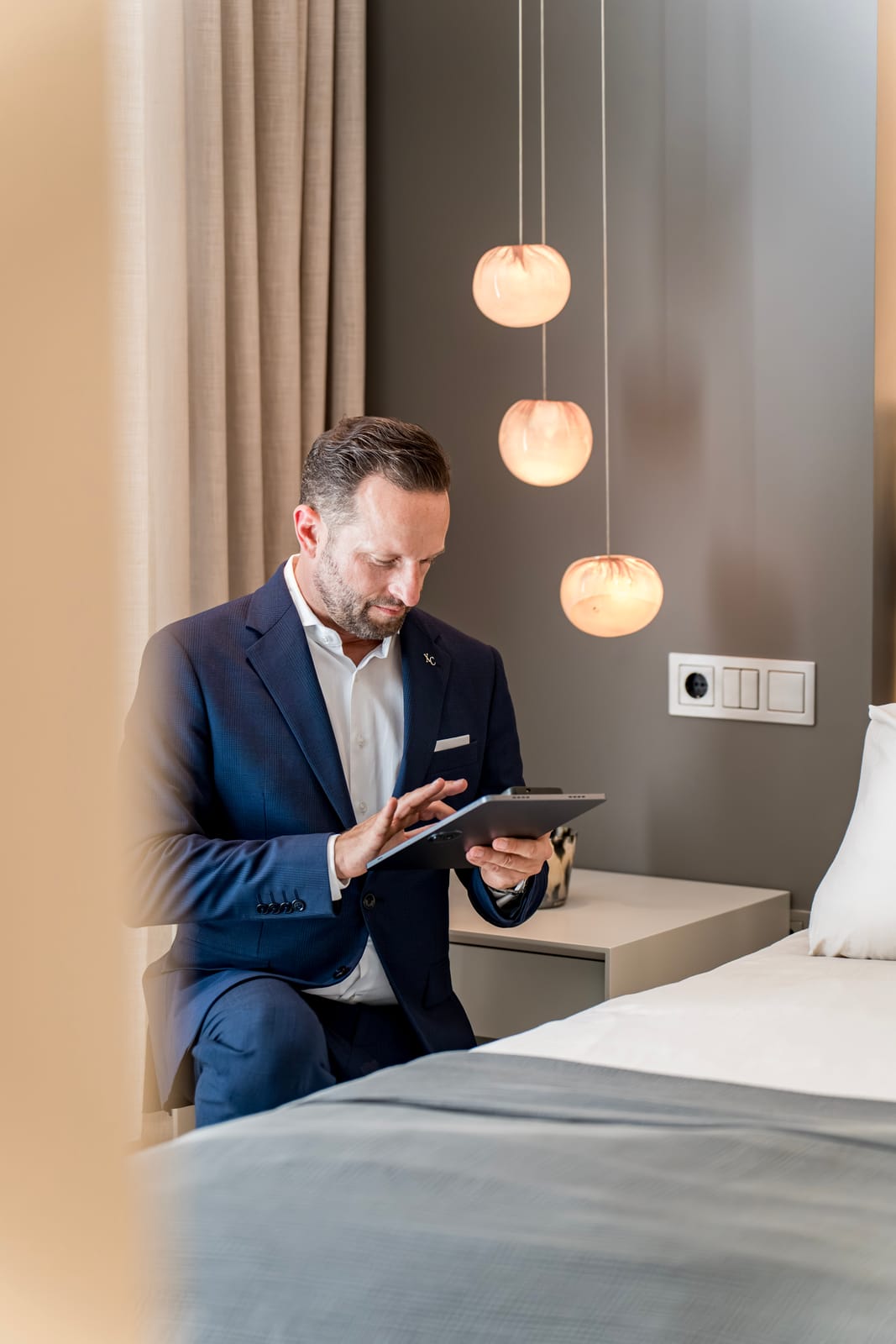 Concierge managing guest requests on a tablet
